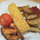 Pikante Kartoffelwedges mit Mais, Tomate und Süßkartoffeln